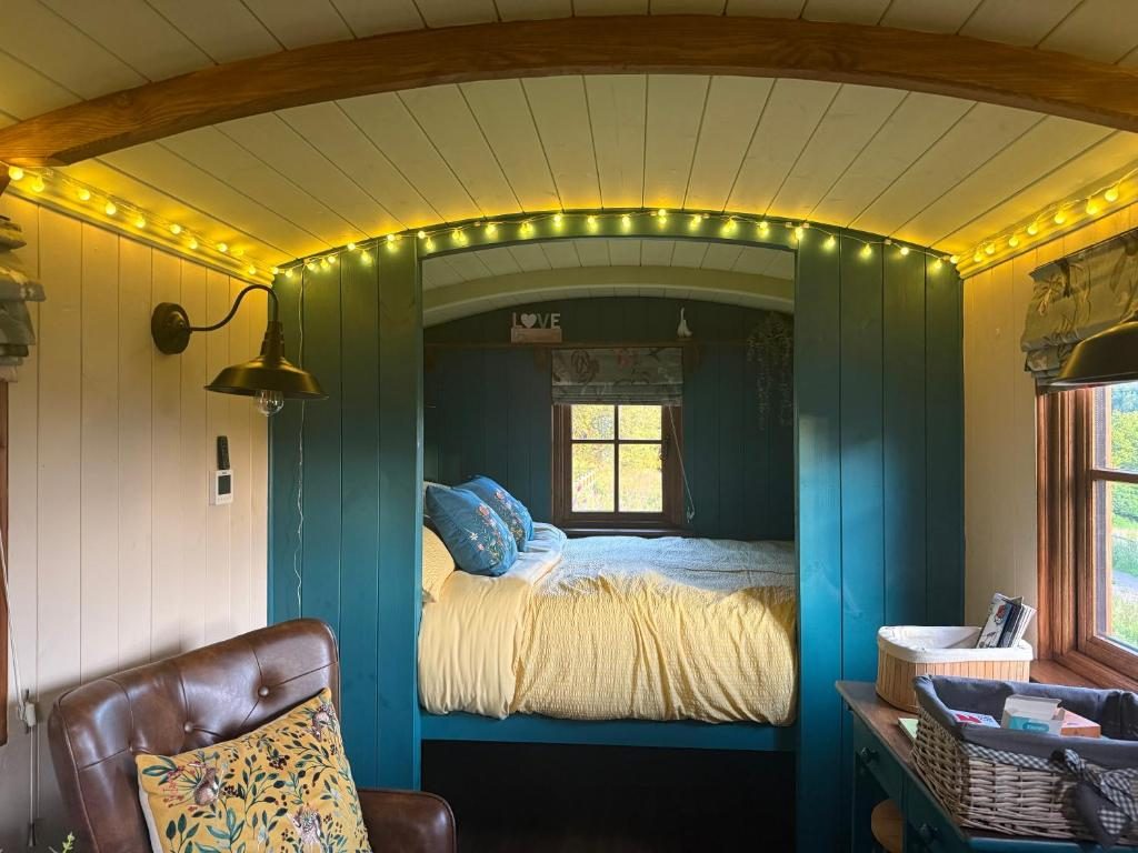 The bed alcove under fairy lights