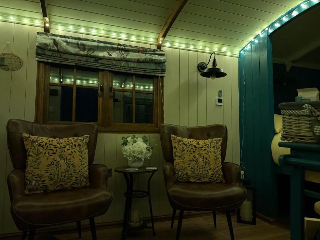 The hut interior lit by fairy lights at night