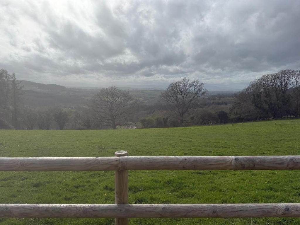 Fields and trees rolling down to the valley